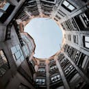 Worm's eye view of an architectural interior in Barcelona, Spain, showcasing perspective and geometry.