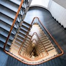 Aerial view of a modern geometric spiral staircase in a Hamburg interior.